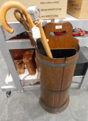 Hall umbrella stand formed as a half banded barrel, with an umbrella,