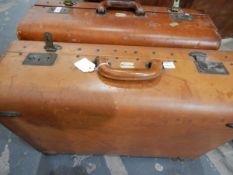 Two vintage leather suitcases labelled 'Garstin' and another leather suitcase (3)