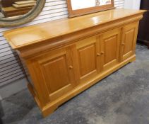 Modern pale chestnut sideboard by Simon Knowles, with three cushion frieze drawers,