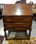 20th century oak bureau with fitted interior, two long drawers,