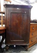 19th century oak corner cupboard with fluted sides, panel door enclosing three shaped shelves,