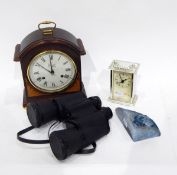 A pair of binoculars, two clocks,