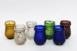 Seven late Victorian/early 20th century coloured moulded glass night lights,