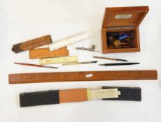 Assorted wooden rulers,