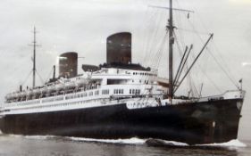 Framed photograph of a two-funnel steam ship,