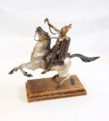 Silvered figure of a warrior on horseback, on a stepped marble plinth with inscribed bronze plaque,
