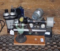 Pultra watchmaker's lathe, a Mercer watchmaker's tool with gauge,