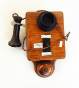 Wall-mounted Ericsson Railway telephone in oak case, with Seimens fittings,