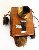 Wall-mounted Ericsson Railway telephone in oak case,