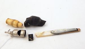 Carved wooden dog whistle in the form of a hound's head with glass eyes,