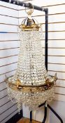 20th century brass electrolier, three-tier with graduated cut glass droplets,