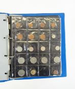 Blue folder and contents of British and foreign 20th century coinage and an album of stamps