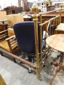 Old brass bedstead raised on castors, with bed irons,