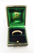 Two gold wedding rings of ropetwist design, unmarked, bought as 18ct gold from Elizabeth Gage,