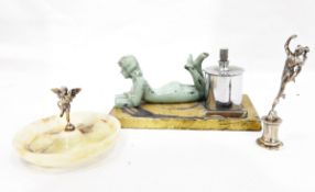 Art Deco- style table lighter surmounted by green painted figure of girl reading a book,