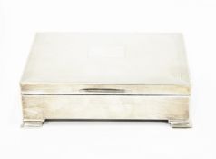 Silver cigarette box, Birmingham 1956, of engine turned rectangular form, on stepped feet,