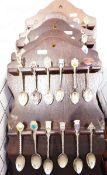 Large quantity of souvenir teaspoons on fitted racks (1 box)