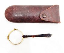 Pair of gold plated folding lorgnettes with gilt metal and tortoiseshell handle,