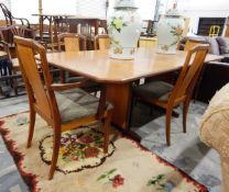 G-Plan extending boardroom table, with canted corners, and extra leaf on inlaid pedestal supports,