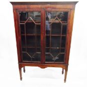 Edwardian mahogany glazed bookcase with Greek key pattern corners,