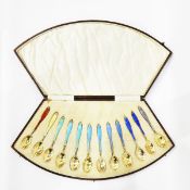 Set of 12 silver-gilt and enamel coffee spoons by Henry Clifford Davis, Birmingham 1928,