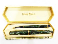Conway Stewart fountain pen and propelling pencil in mottled green case,
