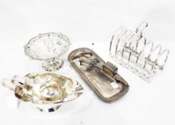Pair of silver-plated candle snuffers and tray, a large silver plated six division toast rack,