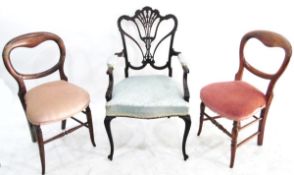 Edwardian mahogany framed open arm elbow chair having shaped and carved crest rail,