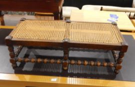 Brass standard lamp with circular base and reeded column and an oak and cane topped footstool