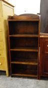 Two narrow oak four-tier open bookcases (2)