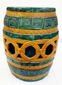 Late 19th century majolica barrel garden seat, pierced with key decoration, teal and ochre glaze,