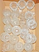 Large quantity of moulded glass pudding bowls,