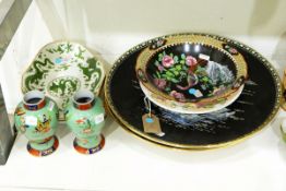 Pair of 19th century dishes of lobed oval form, decorated with dragons in green enamel,