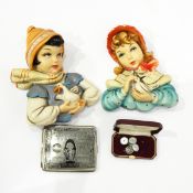 Walnut Westminster chime mantel clock, a pair of plaster wall plaques of girls holding birds,