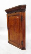 19th century oak corner cupboard with Greek key pattern and fluted frieze,