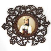 Three porcelain plaques depicting girls in traditional costumes,