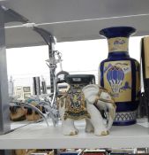 Brass-coloured metal chandelier, a modern freeform metal electrolier, a large ceramic urn,