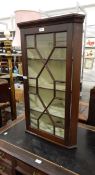 Late 19th century mahogany hanging corner cupboard enclosed by an astragal bi-glazed door,