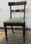 Set of 12 William IV mahogany dining chairs with curved overset shoulderboards, carved crossrails,
