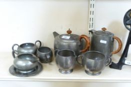 Tudric pewter teaset comprising teapot, hot water jug, two-handled sugar bowl and milk jug,