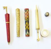 Victorian red stained bone needlecase modelled as a parasol,