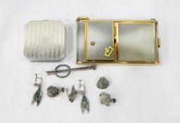 Combination musical compact with cigarette compartment, compact section and lipstick container,