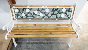 Slatted garden bench seat with painted decorative iron panelled back and standards