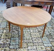 Teak circular extending dining table, by McIntosh,