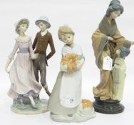 Three various Nao by Lladro porcelain figure groups to include girl holding pumpkin,