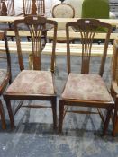 Pair of oak dining chairs, the high backs with pierced splats,