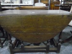 Oak fall-flap gateleg table on baluster turned supports,