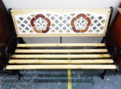 Slatted garden bench seat with decorative painted iron trellis panelled back,