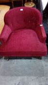 Mid 20th century tub armchair in cherry red slub fabric,