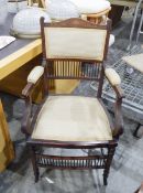 Edwardian elbow chair, the cresting rail inlaid with an urn and garlands,